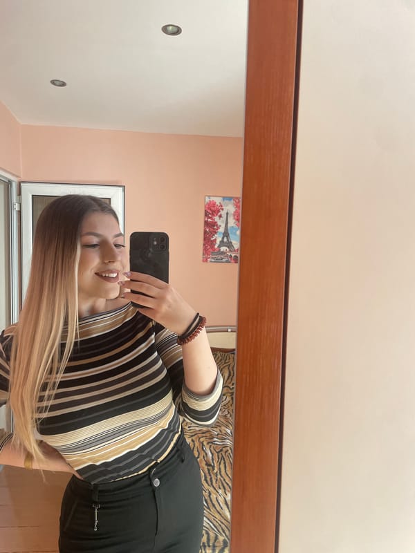 Woman takes mirror selfie in Burgas, Bulgaria