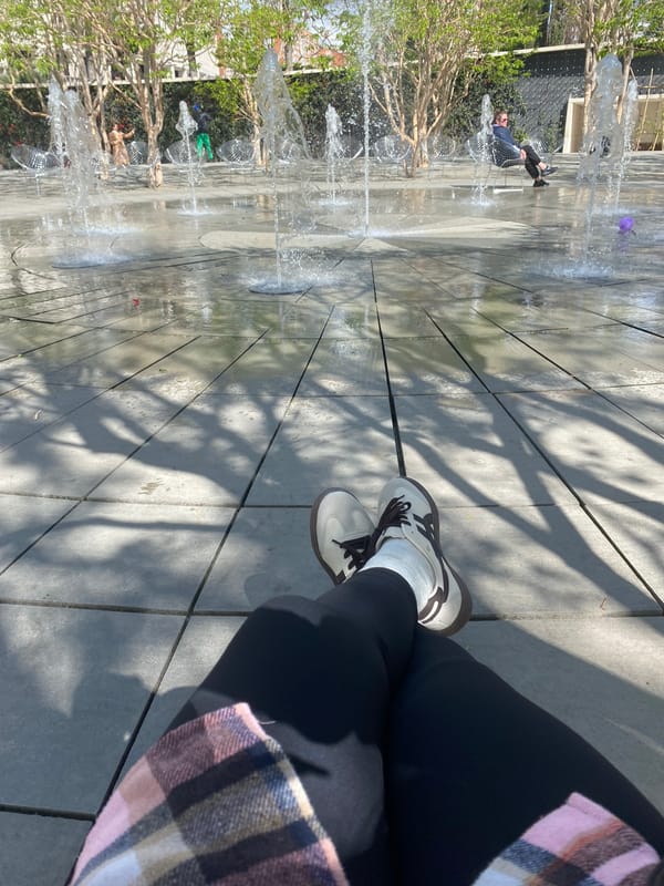 Person takes morning selfies by fountain in Krasnodar
