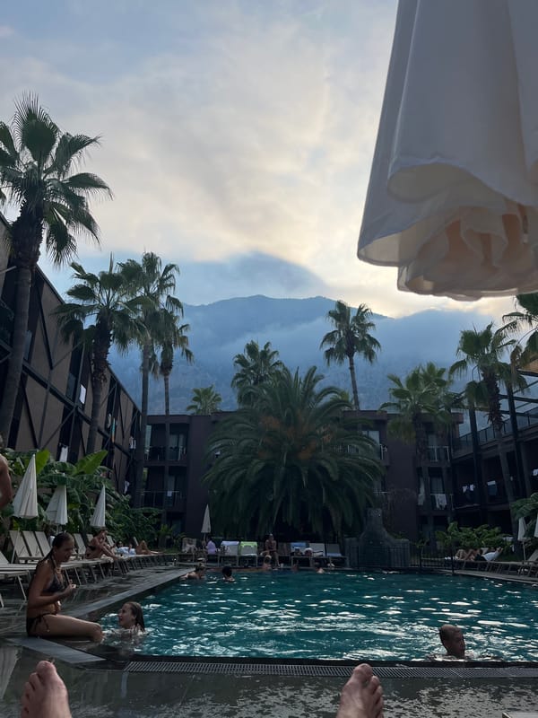 Poolside afternoon at a mountain-backdrop resort