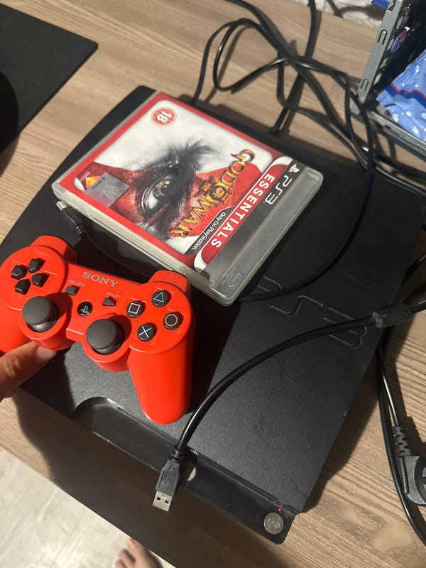 PlayStation 3 gaming setup documented with controller and game