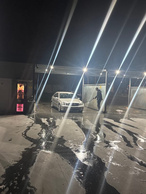Man washes Mercedes at car wash in Plovdiv, Bulgaria