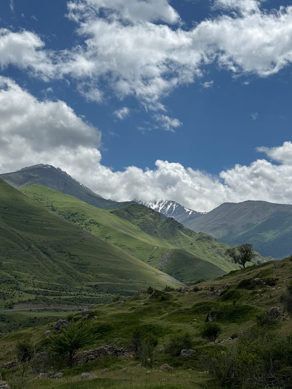 Ancient stone ruins and mountain peaks in El'tiubiu, Russia