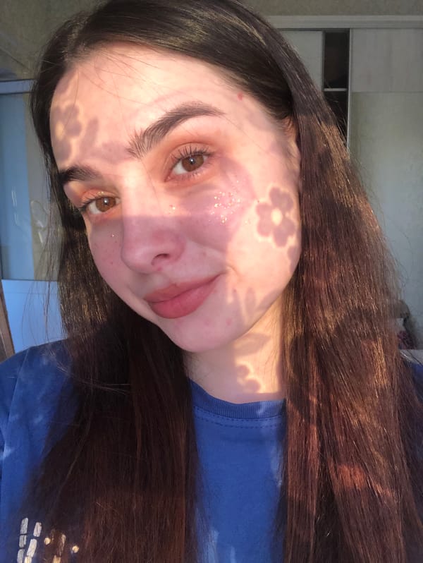 Woman conducts indoor selfie session in Noviy, Russia