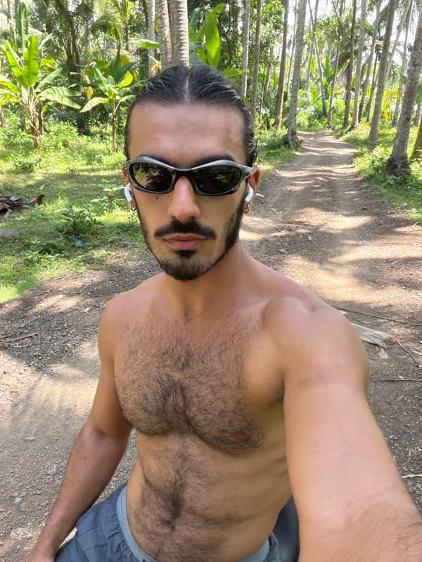 Man takes selfie on rural path in Karangasem