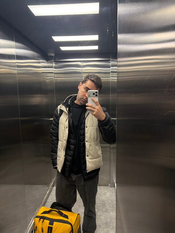 Person Takes Mirror Selfie in Tbilisi Elevator