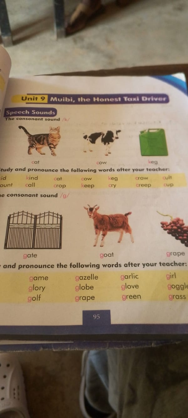 Nigerian primary school textbooks and classroom setting, midday