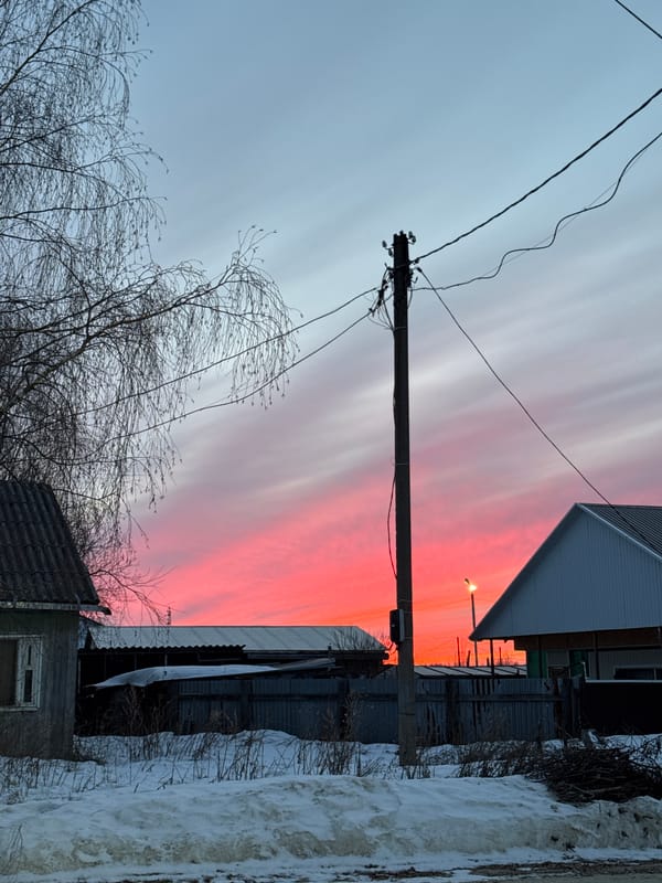 Sunset illuminates street scene in Vysokiy, Russia