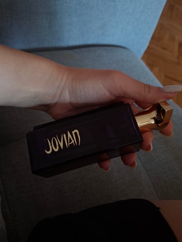 Person holds Jovian perfume bottle in Pleven, Bulgaria