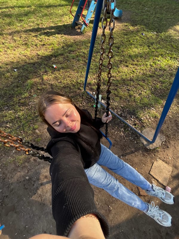 Woman observed at playground swing in Izhevsk early morning