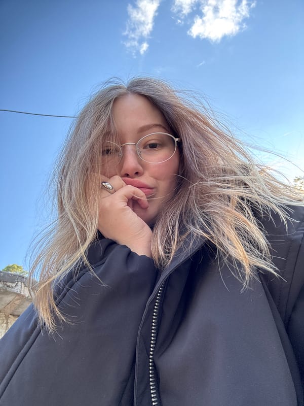 Person takes contemplative selfie under blue sky