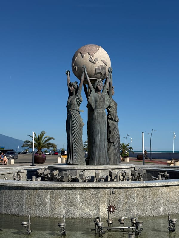 Afternoon at Sirius: pebble beach, selfies, and fountain sculpture