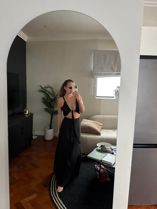 Woman takes mirror selfie in Cape Town home setting