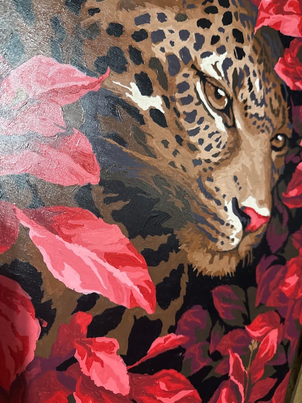 Leopard painting with red leaves observed by witness