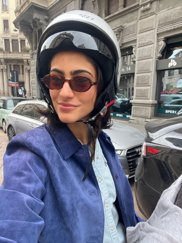 Woman takes helmet selfies in Milan