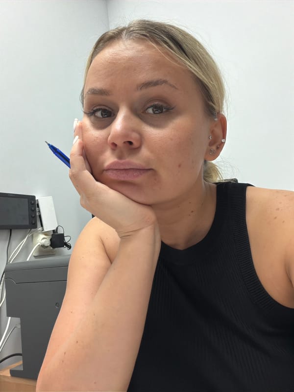 Woman rests with pen in hand in Sarapul