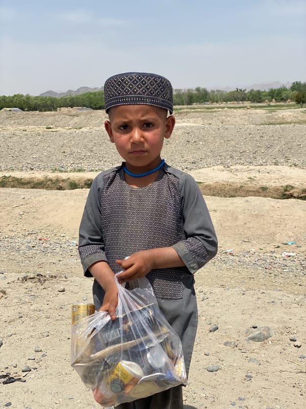 Child in traditional dress observed in rural Afghanistan