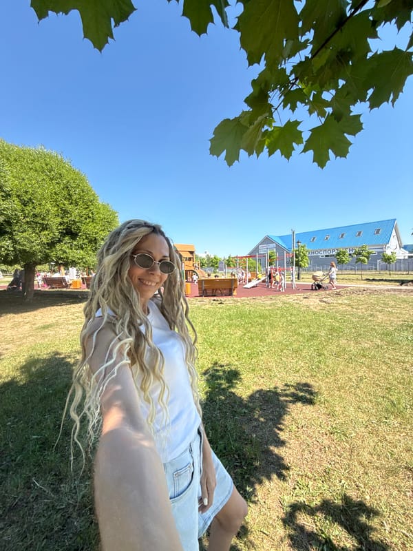 Woman and child enjoy morning at amusement park
