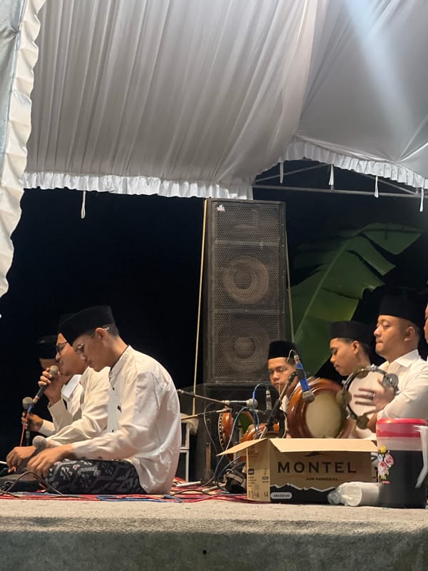 Traditional Indonesian musical performance draws community gathering in Wedarijaksa