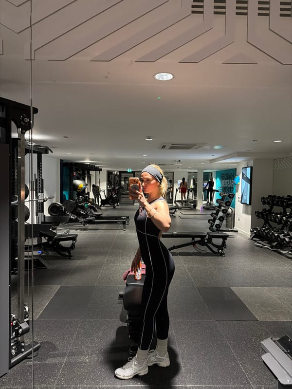 Woman takes gym selfies in Salford fitness center