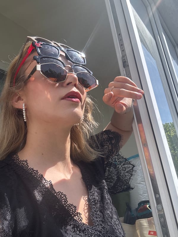 Woman models Spider-Man sunglasses during indoor photo session in Riga