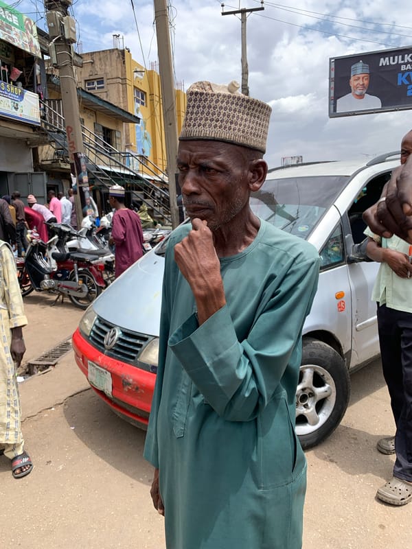 Daily life unfolds on Jos streets during midday hour