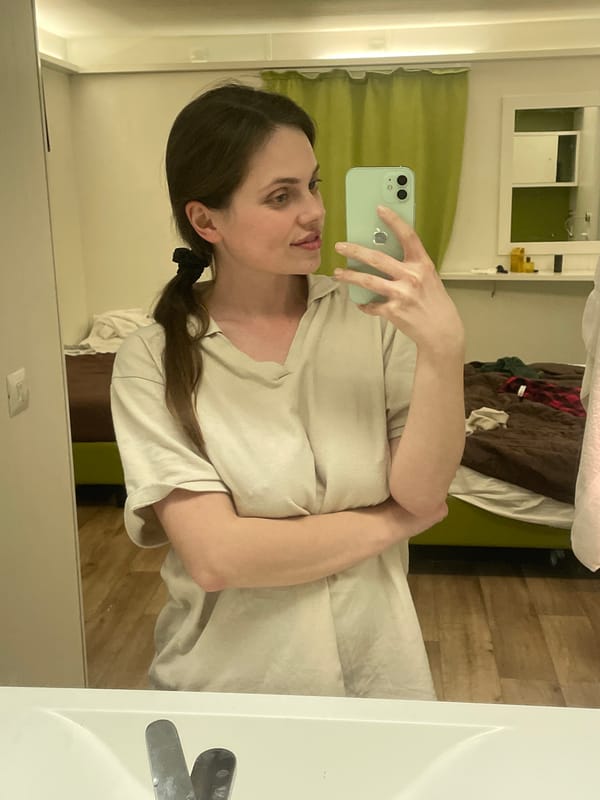 Woman takes mirror selfies in Venice hotel bathroom
