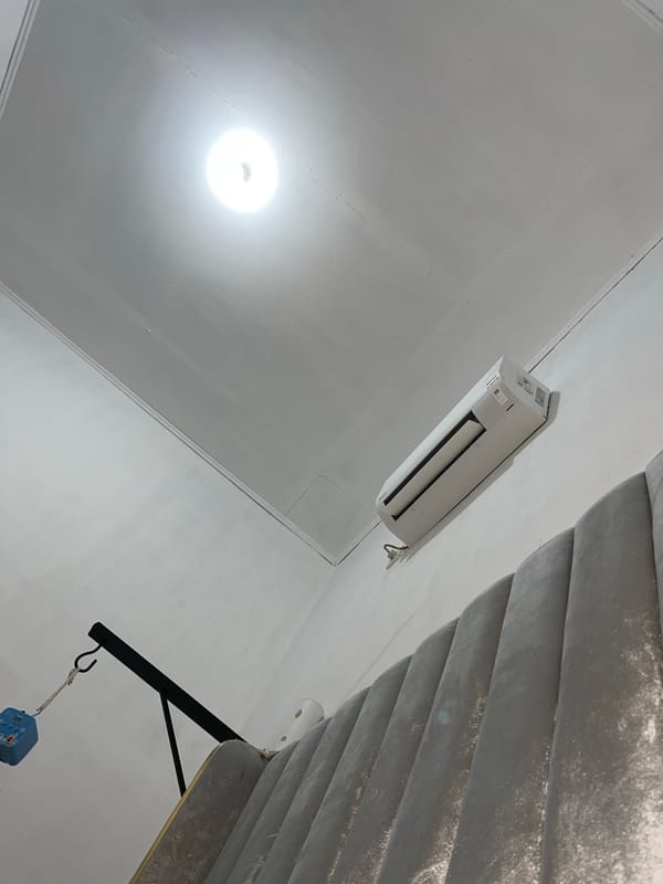 Domestic life captured in Lhokseumawe bedroom during evening hours