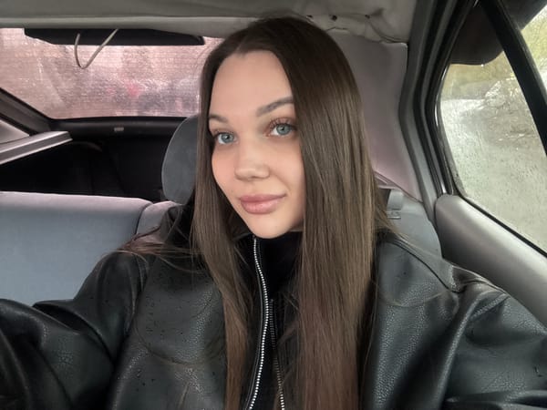 Woman in black jacket observed in stationary car, Yekaterinburg