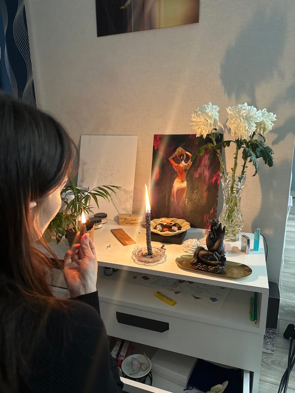 Woman observed in candlelit indoor setting in Murino, Russia