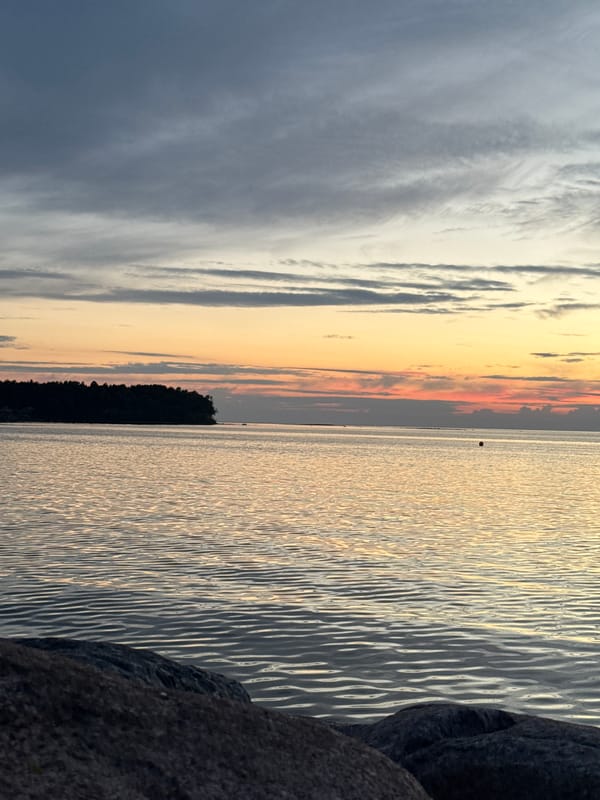 Sunset over rocky Baltic shoreline near Tallinn