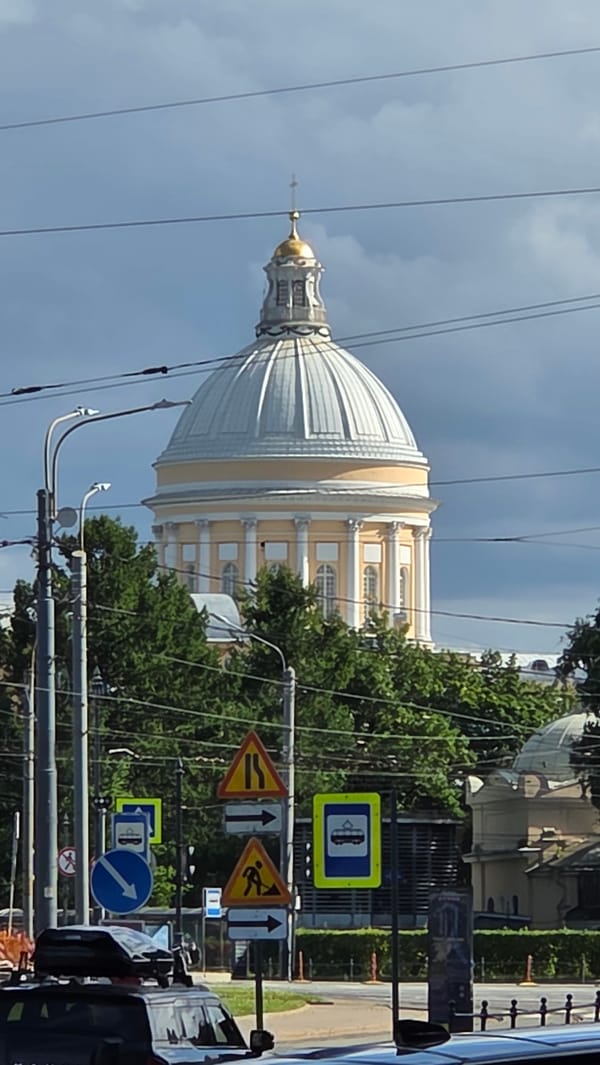 Golden dome and cross of a Saint Petersburg cathedral, up close.