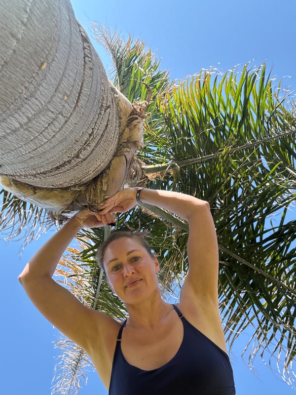 Woman takes morning selfies at Turkish resort palm trees
