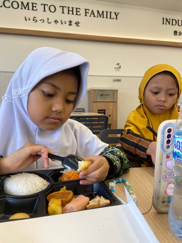 Children share meal at Sidoarjo restaurant early morning