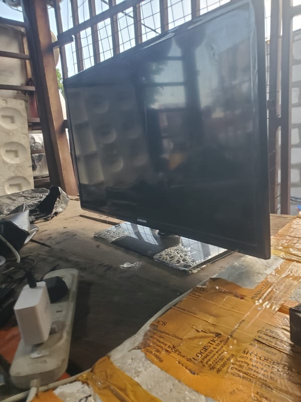 TV delivery and pedestrian activity observed in Adankolo, Nigeria