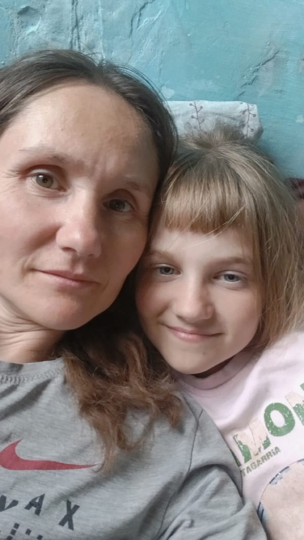 Woman and two girls captured in family selfie moments