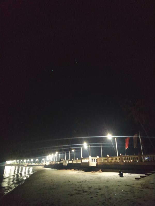 Nighttime waterfront promenade documented in Badem, India