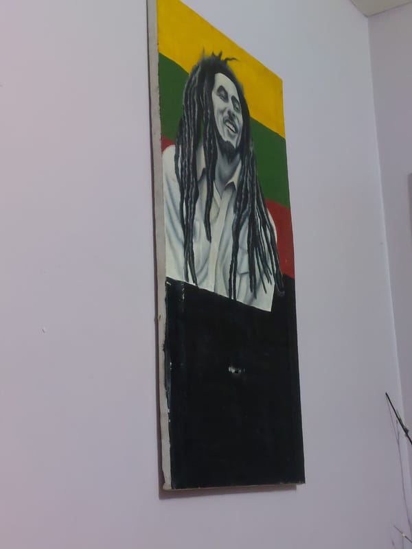 Dar es Salaam scenes: Bob Marley art, child with phone