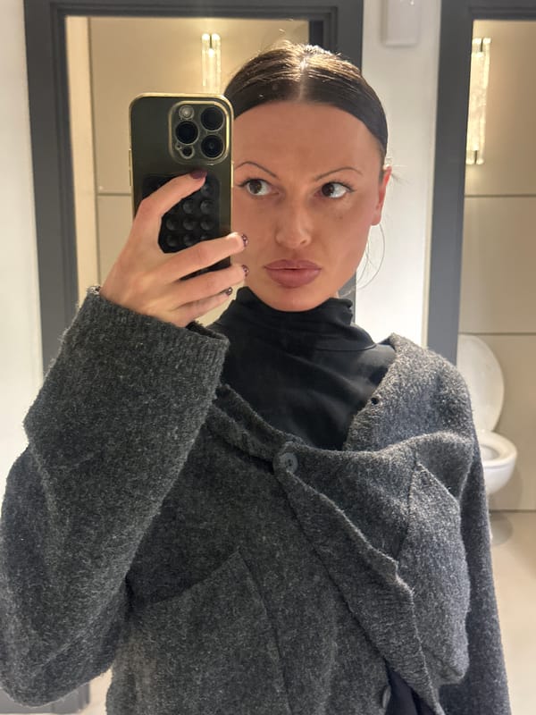 Woman takes mirror selfie indoors in London