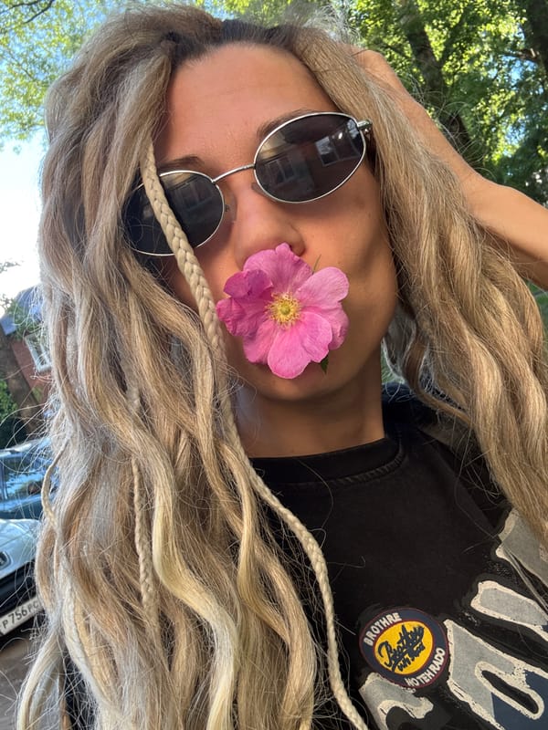 Blonde-braided individual photographed outdoors in Rusanovo, Russia
