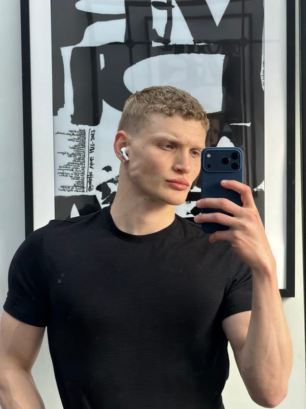 Young man takes selfie with smartphone in central London