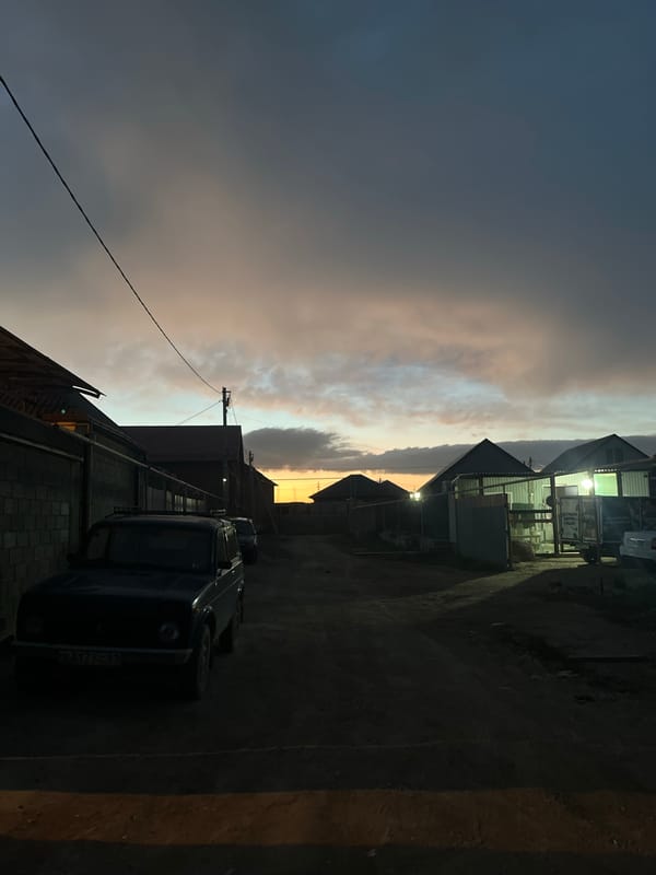 Evening street scene captured in Kaspiysk, Russia during dusk