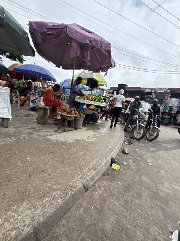 Street-level commerce and foot traffic in Ado, Nigeria