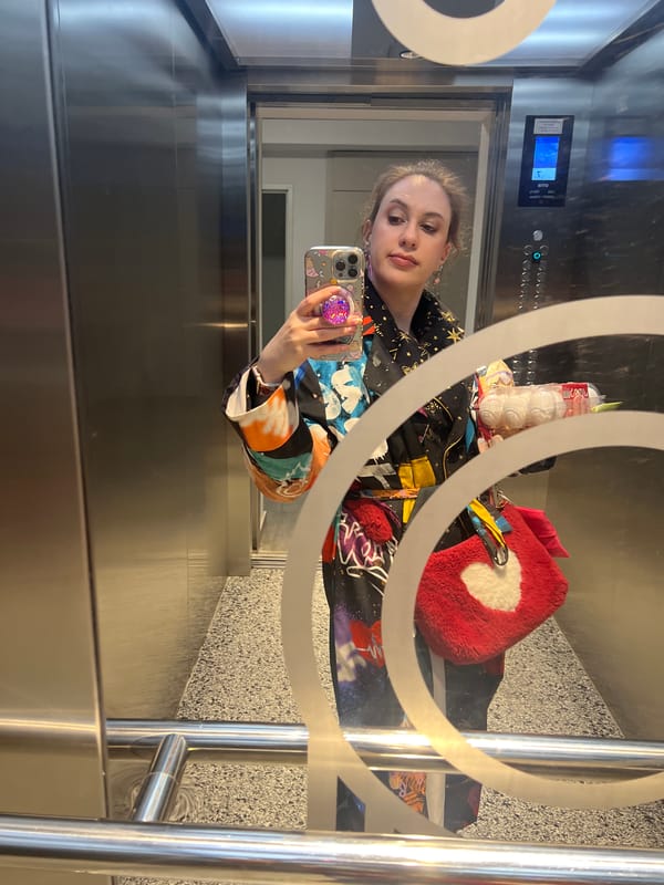 Woman takes elevator mirror selfie in Tbilisi