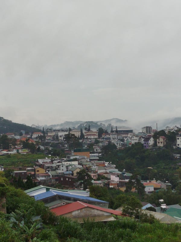 Foggy morning panorama captures Da Lat's hillside architecture