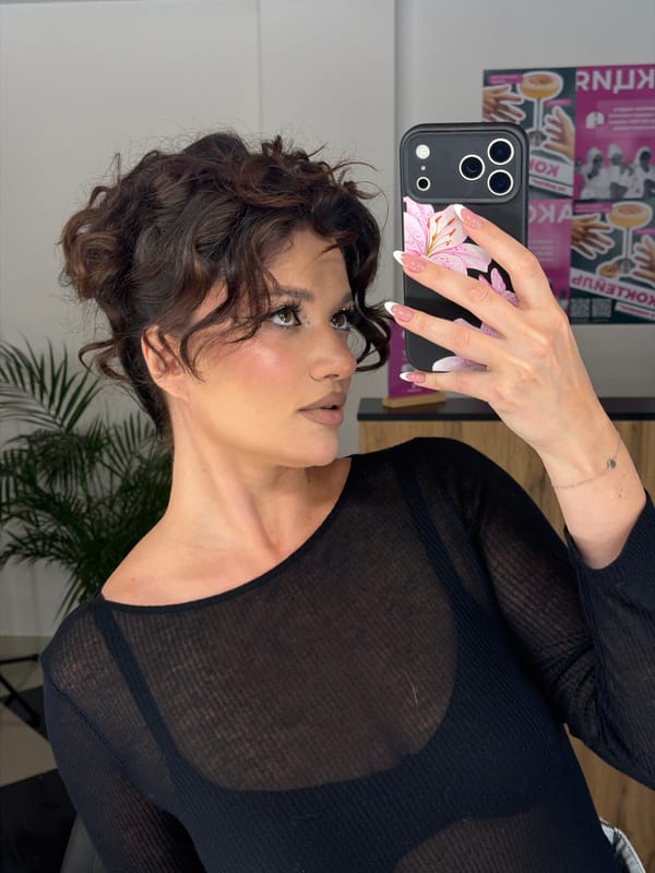 Woman takes selfies during hair appointment in Belgrade salon