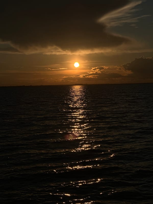Orange sunset over water in Kokshetau, Kazakhstan