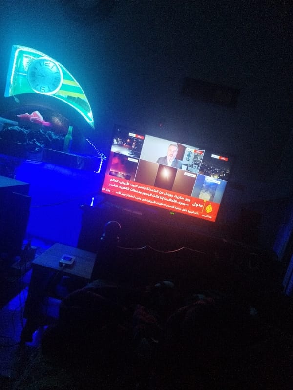 Late night Al Jazeera news viewing captured by witness