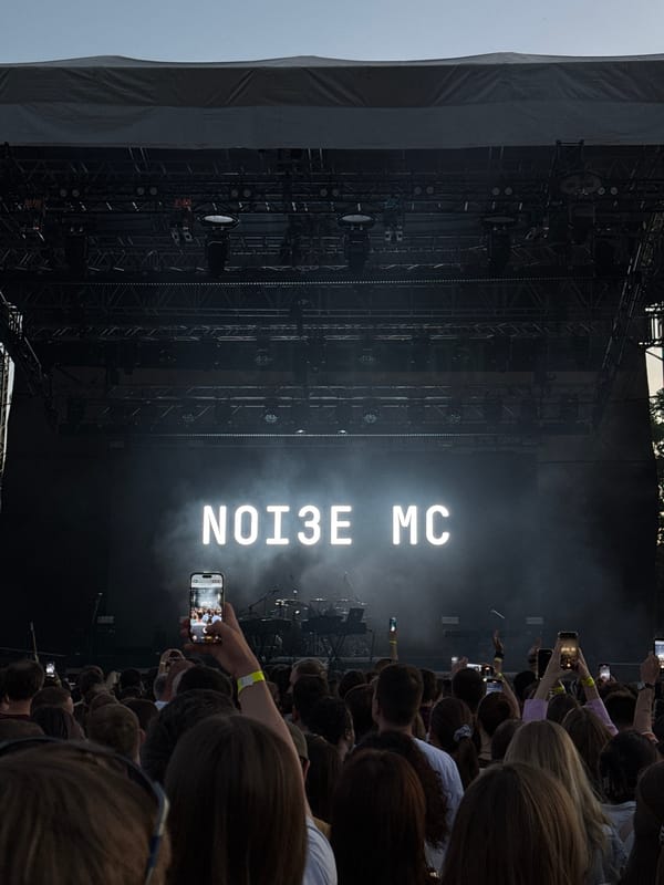 NOISE MC concert at outdoor venue with illuminated stage