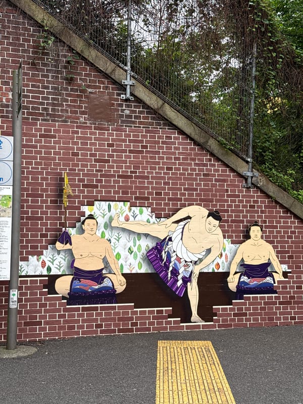 Early morning street art and shrine activity documented in Shibuya