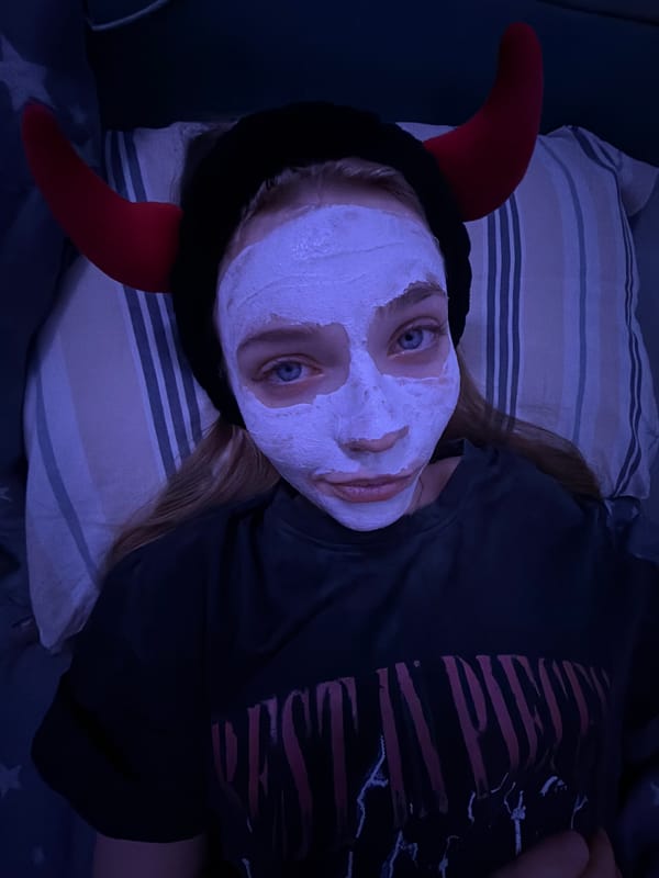 Face mask and devil horns: a casual self-care moment at home